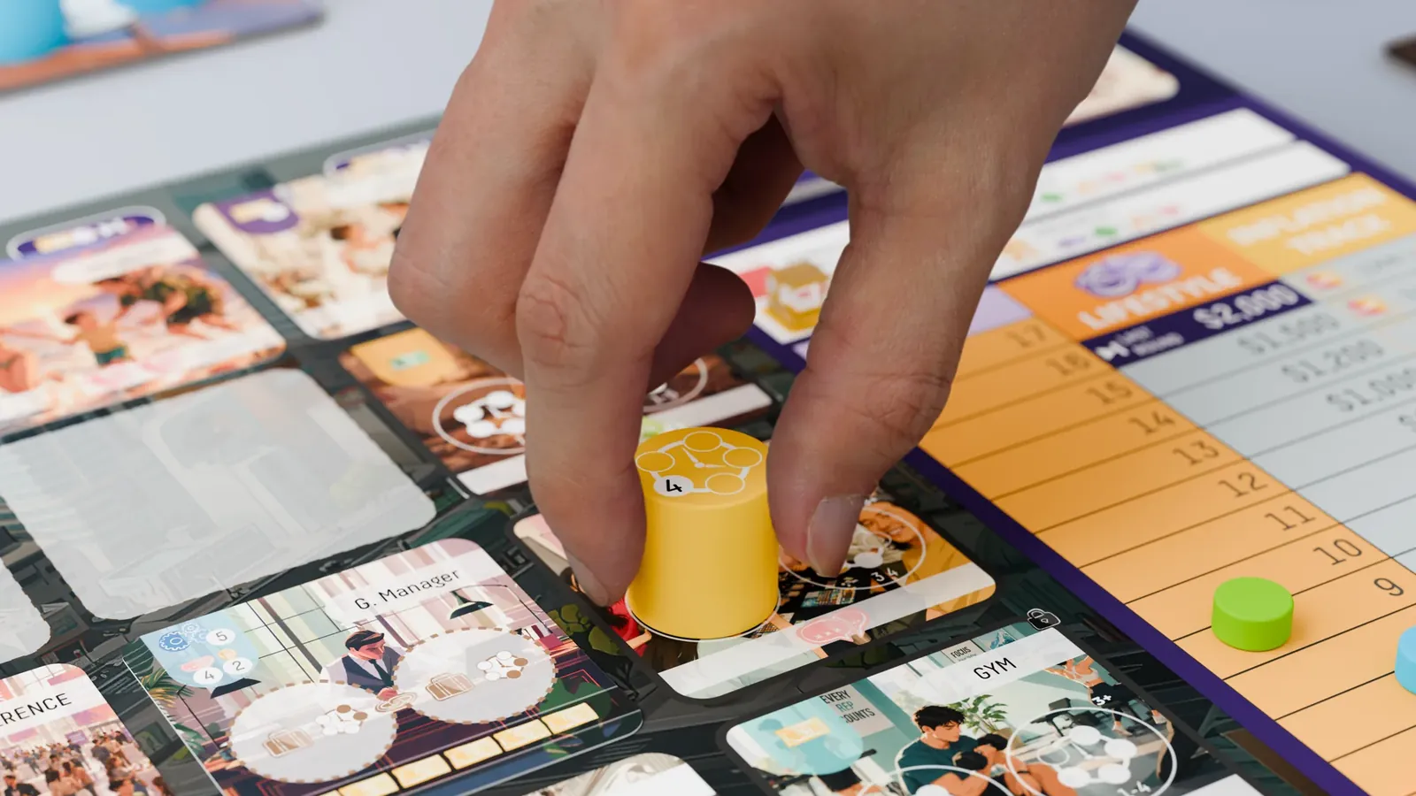 A hand placing a yellow time marker on the board